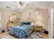 Cozy main bedroom with ornate decor, hardwood floors, and a comfortable bed at 2631 Rolling Hills Way, Conyers, GA 30094
