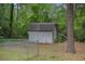 A backyard storage shed, providing ample space for gardening tools and outdoor equipment at 2631 Rolling Hills Way, Conyers, GA 30094