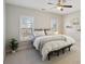 The bedroom includes two windows, a ceiling fan, neutral colors, a plant, and decorative shelving at 3332 Old Concord Se Rd, Smyrna, GA 30082