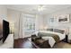 Relaxing bedroom featuring a large window with natural light and stylish decor at 3332 Old Concord Se Rd, Smyrna, GA 30082
