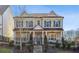 Charming two-story brick home features a manicured front yard, a wrought iron fence and a covered front porch at 3332 Old Concord Se Rd, Smyrna, GA 30082