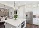 Bright and airy kitchen features a large center island, stainless steel appliances, and pendant lighting at 3332 Old Concord Se Rd, Smyrna, GA 30082