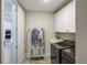 Functional laundry room with modern appliances and storage cabinets at 3332 Old Concord Se Rd, Smyrna, GA 30082
