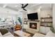 Open-concept living space with fireplace, coffered ceilings, and view to adjacent kitchen and dining areas at 3332 Old Concord Se Rd, Smyrna, GA 30082