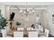 Open-concept dining and living area includes fireplace, coffered ceilings and views to adjoining areas at 3332 Old Concord Se Rd, Smyrna, GA 30082