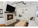 Inviting living room with brick fireplace, floating shelves, and lots of natural light at 3332 Old Concord Se Rd, Smyrna, GA 30082