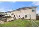 A spacious backyard with grass, a patio, volleyball net and a barbecue grill at 4699 Price St, Forest Park, GA 30297