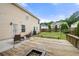 Large backyard features a wooden deck with a fire pit, seating area, and a volleyball net for outdoor activities at 4699 Price St, Forest Park, GA 30297