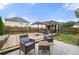Cozy backyard featuring a wooden deck, patio with seating, and an outdoor grilling area perfect for entertaining at 4699 Price St, Forest Park, GA 30297
