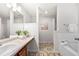 Bathroom featuring a bathtub and a sink with a tile floor at 4699 Price St, Forest Park, GA 30297