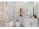 Bathroom with a white single sink vanity, toilet, shower, and modern decor at 4699 Price St, Forest Park, GA 30297