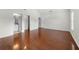 Bedroom with hardwood floors, a light-filled window, and an open ensuite bathroom at 4699 Price St, Forest Park, GA 30297