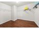 Spacious walk-in closet with wood laminate flooring and wire shelving ready for customization at 4699 Price St, Forest Park, GA 30297