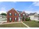 Traditional brick home with black shutters, manicured lawn, and a welcoming entryway at 4699 Price St, Forest Park, GA 30297