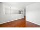 Hallway with hard wood flooring features railing with view to the living room downstairs at 4699 Price St, Forest Park, GA 30297