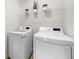 Convenient laundry room with modern washer and dryer, plus shelving at 4699 Price St, Forest Park, GA 30297