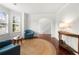 Bright living room with hardwood floors, neutral walls, and large windows at 4699 Price St, Forest Park, GA 30297
