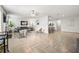 Spacious living room seamlessly connects living, dining, and kitchen areas with modern decor and fireplace at 4699 Price St, Forest Park, GA 30297