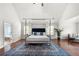 Bright main bedroom with a four poster bed, sitting area, and ensuite bathroom at 4699 Price St, Forest Park, GA 30297