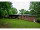 Back exterior of the home with screened in porch and brick facade at 87 Valley Rd, Lawrenceville, GA 30044