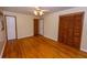 Spacious bedroom showcases hardwood floors, ample closet space, and neutral walls at 87 Valley Rd, Lawrenceville, GA 30044