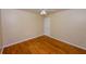 Bedroom boasts hardwood floors, white trim, a ceiling fan, and neutral walls at 87 Valley Rd, Lawrenceville, GA 30044