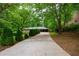 Lovely home on a lush lot featuring mature landscaping and a long driveway at 87 Valley Rd, Lawrenceville, GA 30044