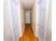 Hallway with hardwood floors connects various rooms at 87 Valley Rd, Lawrenceville, GA 30044