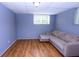 Comfortable living room features beautiful hardwood floors, and bead board walls at 87 Valley Rd, Lawrenceville, GA 30044
