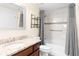 A clean bathroom featuring a granite countertop, tiled shower/bath and modern sink at 275 13Th Ne St # 409, Atlanta, GA 30309