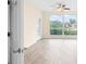 A bright, open bedroom with hard wood floors and large windows that offer an outside view at 275 13Th Ne St # 409, Atlanta, GA 30309