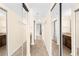 A hallway that features hard wood floors, large mirrored closets, and access to a bathroom at 275 13Th Ne St # 409, Atlanta, GA 30309