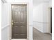 Unit front door with white trim, brass hardware, and gray door at 275 13Th Ne St # 409, Atlanta, GA 30309