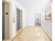 Hallway with elevator access, marble floors, decorative trim, and a painting at 275 13Th Ne St # 409, Atlanta, GA 30309