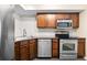 A well-equipped kitchen featuring stainless steel appliances and dark wood cabinets at 275 13Th Ne St # 409, Atlanta, GA 30309