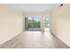 A bright, airy living room with hardwood floors and sliding glass doors to a balcony at 275 13Th Ne St # 409, Atlanta, GA 30309