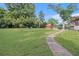 Expansive backyard featuring lush greenery, a shed, and outdoor seating area for relaxation and entertainment at 3510 Spring Valley Blvd, Atlanta, GA 30349