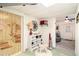 Basement entryway with shoe storage and view into a finished basement at 3510 Spring Valley Blvd, Atlanta, GA 30349