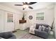 Finished basement with comfortable seating and natural light from the window at 3510 Spring Valley Blvd, Atlanta, GA 30349