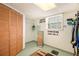 Finished basement with closet storage, mirror, and inspirational wall art at 3510 Spring Valley Blvd, Atlanta, GA 30349