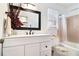 Updated bathroom with new vanity, framed mirror, and shower-tub combination at 3510 Spring Valley Blvd, Atlanta, GA 30349