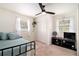 Comfortable bedroom with ceiling fan, carpet, and sun-lit windows at 3510 Spring Valley Blvd, Atlanta, GA 30349
