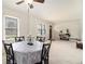 Open dining room with natural light, classic decor, and ample space for entertaining guests at 3510 Spring Valley Blvd, Atlanta, GA 30349