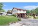Two-story home with an attached carport, screened porch and a beautifully landscaped yard at 3510 Spring Valley Blvd, Atlanta, GA 30349