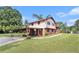Traditional two-story home featuring a carport, brick accents, and a well-maintained lawn at 3510 Spring Valley Blvd, Atlanta, GA 30349