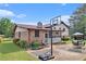 Charming home exterior with well-maintained landscaping, basketball hoop, and inviting outdoor seating area at 3510 Spring Valley Blvd, Atlanta, GA 30349