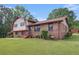 Inviting brick home with a manicured lawn and landscaping, offering classic curb appeal at 3510 Spring Valley Blvd, Atlanta, GA 30349
