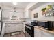 Compact kitchen featuring white cabinets, modern appliances, and a bright, clean design at 3510 Spring Valley Blvd, Atlanta, GA 30349