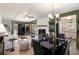 Well-lit living and dining area with an open floor plan, fireplace, and views of the kitchen at 3510 Spring Valley Blvd, Atlanta, GA 30349