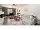 Cozy living room with a comfortable sectional, stylish decor, and an adjacent dining area at 3510 Spring Valley Blvd, Atlanta, GA 30349